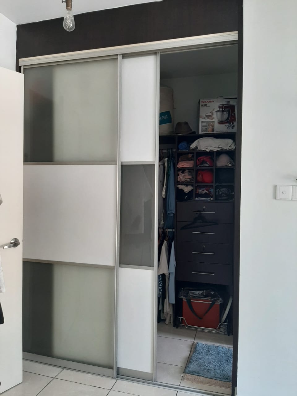 Walk-in wardrobe storage at Casa Indah 1