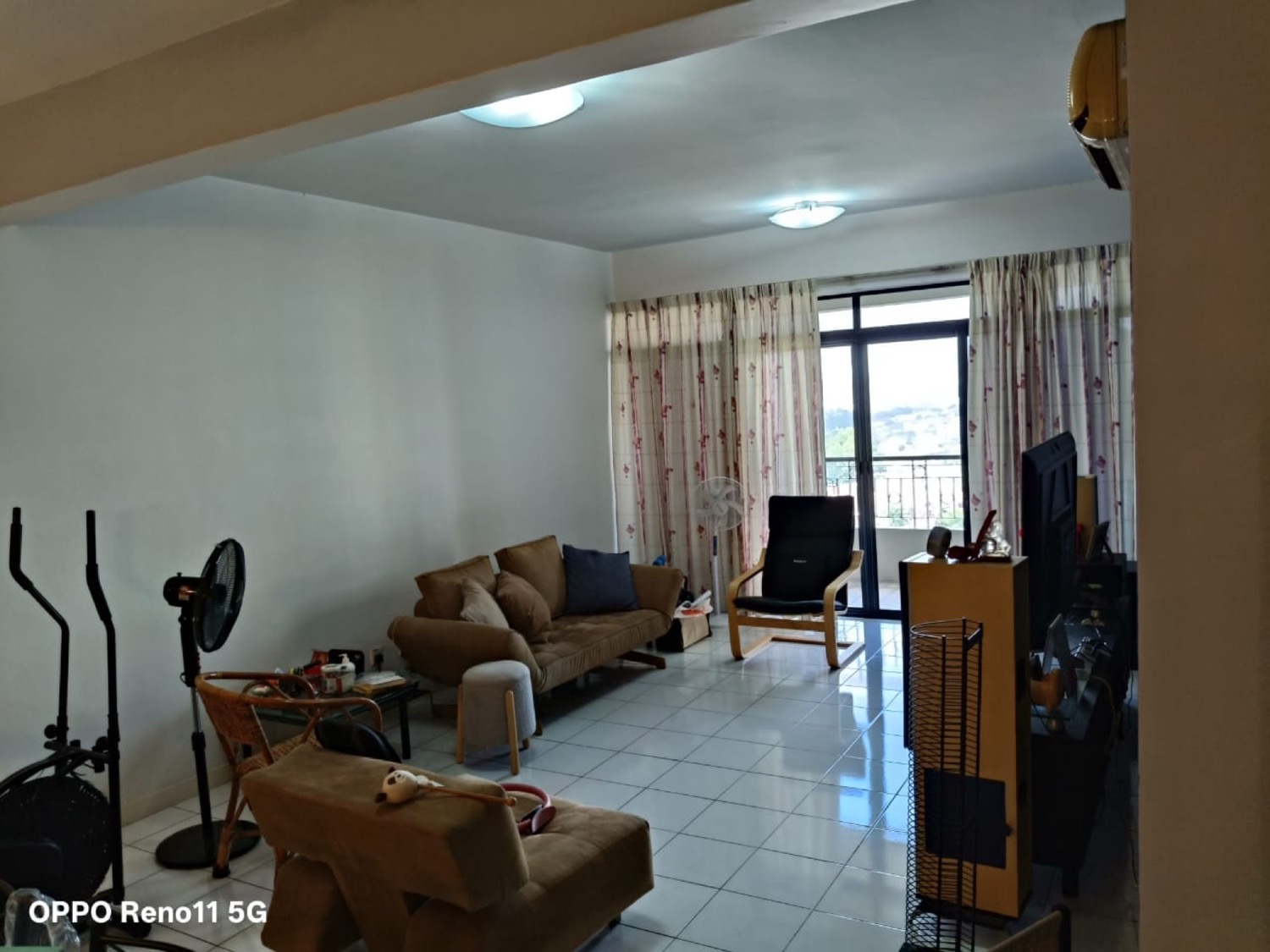 Living area with seating and balcony doors in the Maxwell Tower home for sale
