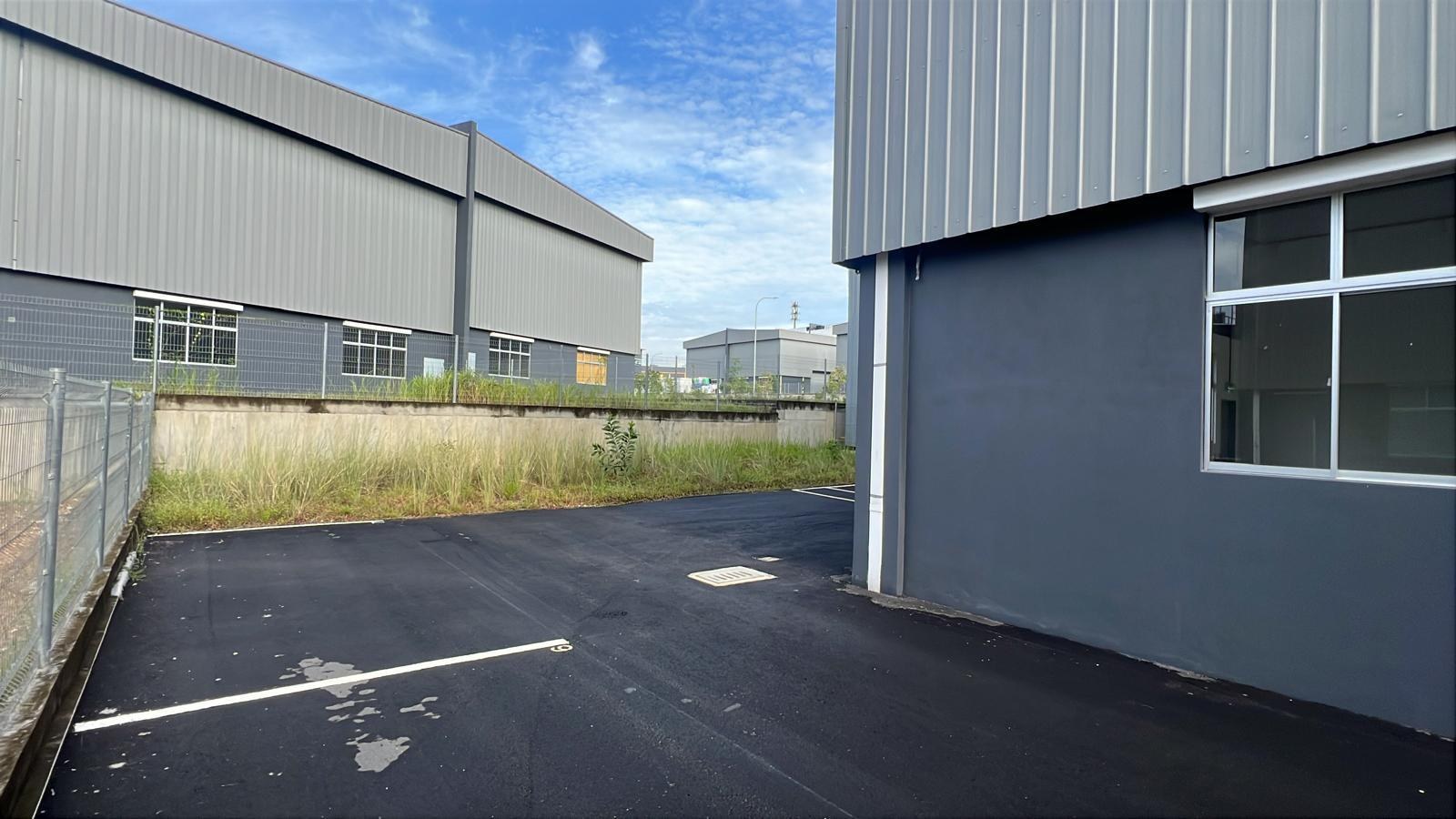 Side driveway and external access beside the XME Business Park factory